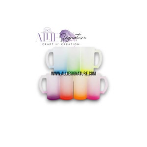 May include: Set of six ombre colour changing mugs with white handles. The mugs are stacked in a pyramid shape. The colours are blue, green, yellow, orange, red, and purple. The mugs are frosted glass and have a gradient effect. The text "www.alliesignature.com" is printed on the bottom of the stack of mugs.