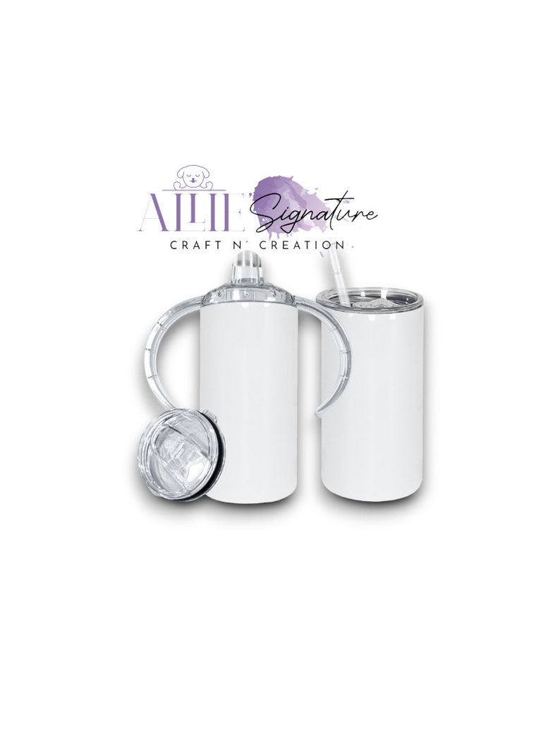 May include: White stainless steel tumbler with a lid and a straw. The tumbler has a handle on each side. The tumbler is blank and ready to be customized.