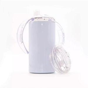 May include: White stainless steel tumbler with two clear plastic handles and a clear plastic lid. The lid has a straw hole.