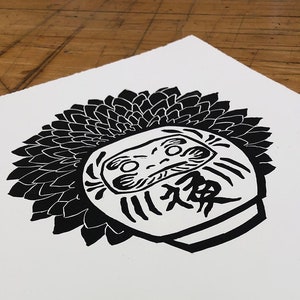 Daruma with chrysanthemum
