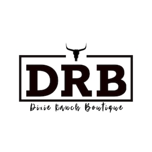May include: A black and white logo for Dixie Ranch Boutique. The logo features the letters "DRB" in a bold, blocky font, enclosed within a rectangular frame. Above the letters is a silhouette of a bull's head. Below the letters is the text "Dixie Ranch Boutique" in a script font.