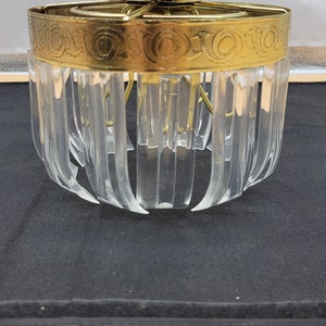 Art Deco style ceiling light fixture.Gold