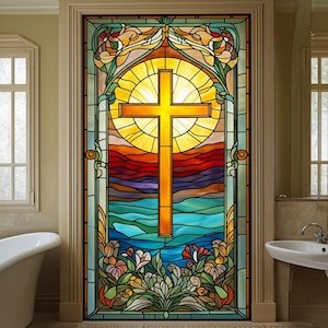 May include: A stained glass door featuring a large yellow cross set against a radiant sunburst. The design incorporates vibrant colors, including blue, orange, and green, with floral accents at the base. The door is framed in a neutral tone.