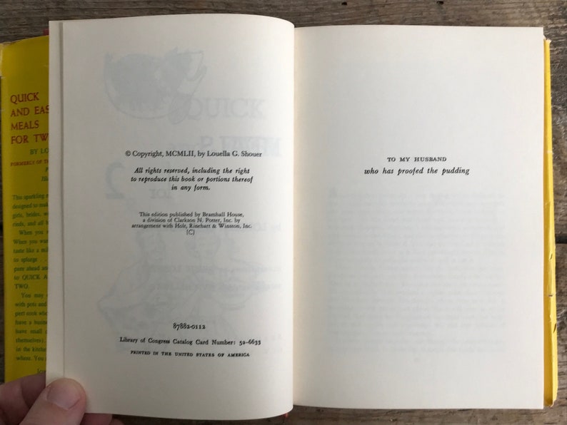 May include: A vintage cookbook titled "Quick and Easy Meals for Two" by Louella G. Shouer. The book cover is yellow with a red and white illustration of a rooster. The copyright date is 1952.