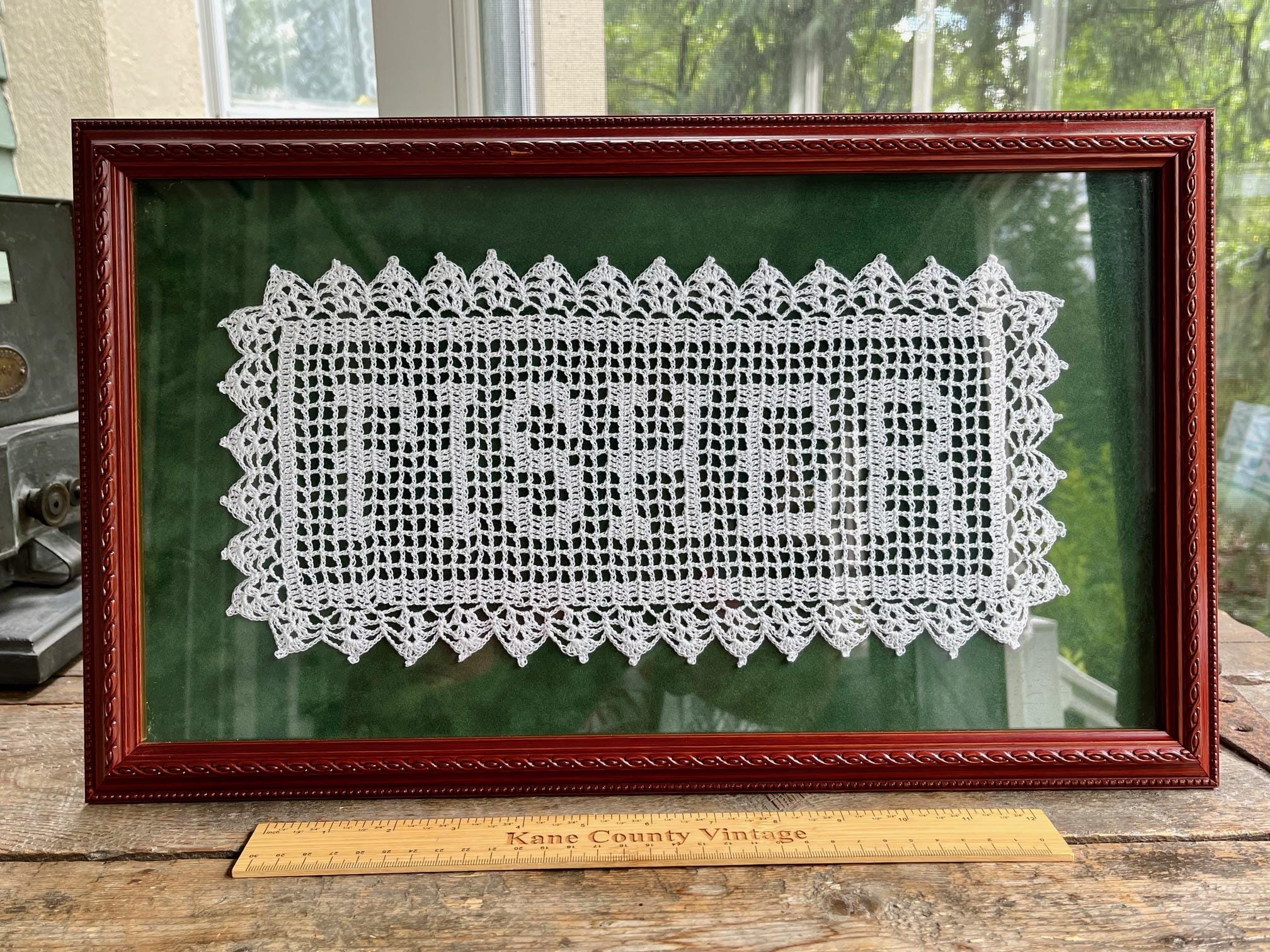 Vintage framed doily, excellent condition - "FISHER" name; white with green background, very nice frame; piece of local history Geneva, IL