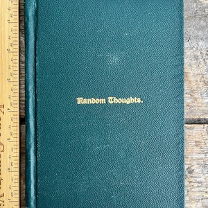 May include: A dark green hardback book with the title "Random Thoughts" printed in gold lettering on the front cover.