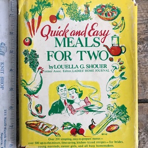 May include: A yellow cookbook with a red and green illustration of a couple cooking. The title is "Quick and Easy Meals for Two" by Louella G. Shouer. The book cover also includes the text "Former Assoc. Editor, LADIES' HOME JOURNAL".