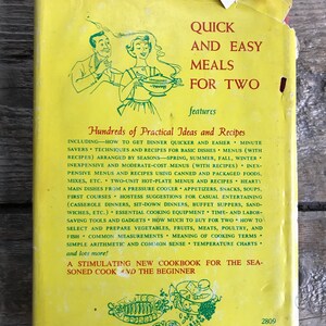 May include: A yellow cookbook cover with a cartoon illustration of a couple cooking. The title of the book is "Quick and Easy Meals for Two" and features hundreds of practical ideas and recipes.