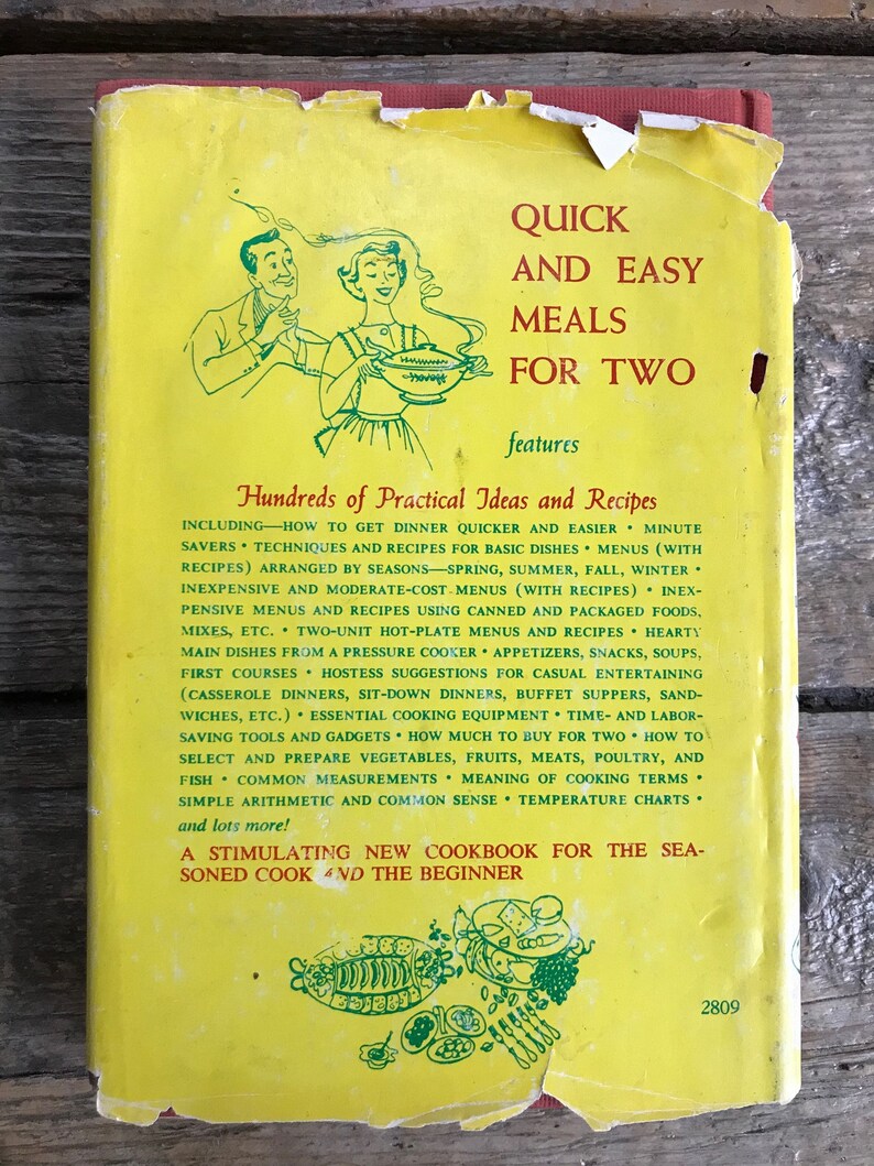 May include: A yellow cookbook cover with a cartoon illustration of a couple cooking. The title of the book is "Quick and Easy Meals for Two" and features hundreds of practical ideas and recipes.