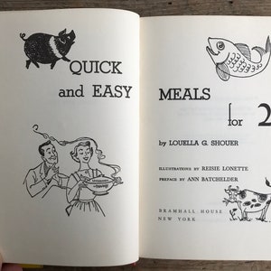 May include: A vintage cookbook titled "Quick and Easy Meals for 2" by Louella G. Shouer. The cover features illustrations of a pig, a fish, and a cow.