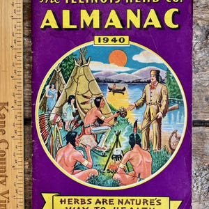 May include: Vintage 1940 "The Illinois Herb Co. Almanac" with a purple cover. The cover features a circular illustration of Native Americans near a lake and teepees. Text includes "Herbs are Nature's Way to Health".