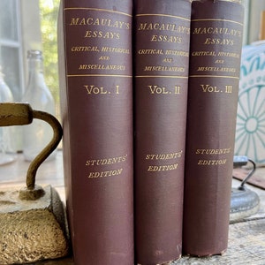 May include: Three brown hardback books titled "Macaulay's Essays" with gold lettering. The books are volumes I, II, and III of a set of critical, historical, and miscellaneous essays. Each book has the words "Students' Edition" printed on the bottom.