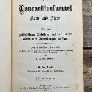May include: Open book page with German text. The title "Concordienformel Kern und Stern" is displayed in ornate black lettering. The page includes additional text and is from a historical publication.
