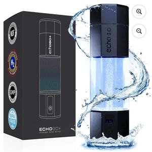 May include: A black and clear EchoGo+ hydrogen water bottle with a water splash effect. The bottle is cylindrical with a black top and base. The product is displayed with its packaging, which includes certifications and the text "ECHO GO+ HYDROGEN WATER BOTTLE".