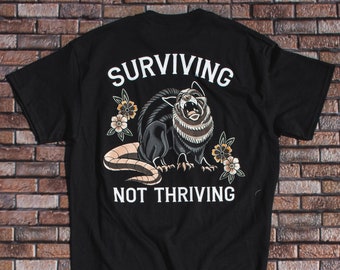 Surviving not thriving Unisex T-shirt