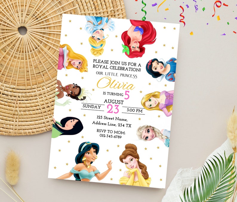 May include: A white invitation with gold stars and a pink and gold border. The invitation features a collage of Disney princesses, including Cinderella, Ariel, Belle, Snow White, Jasmine, Tiana, Rapunzel, and Elsa. The text reads "Please join us for a Royal Celebration! Our little princess Olivia is turning 5 August 23, 3:00 PM. 123 Street Name, Address Line, 234 TX. RSVP to Mom 012-345-6789."