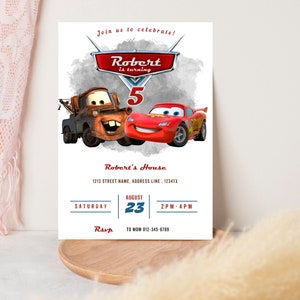 May include: A white invitation card featuring the Cars movie characters Mater and Lightning McQueen. The card reads "Join us to celebrate! Robert is turning 5" with event details including the date, time, and RSVP information.