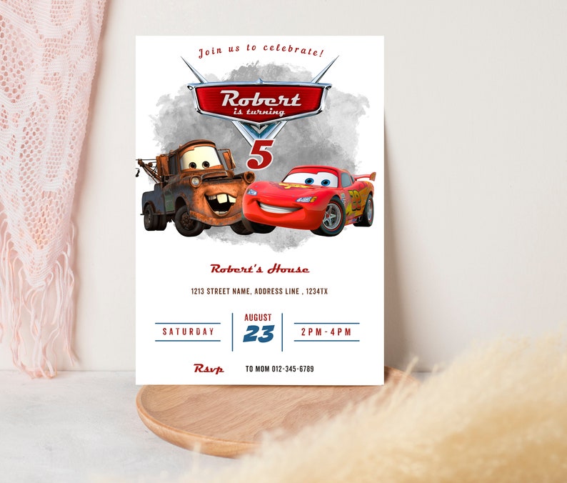 May include: A white invitation card featuring the Cars movie characters Mater and Lightning McQueen. The card reads "Join us to celebrate! Robert is turning 5" with event details including the date, time, and RSVP information.
