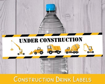 May include: Construction themed water bottle labels with a yellow and black striped background. The labels feature the text "Under Construction" and illustrations of construction vehicles, including a crane, bulldozer, cement mixer, and excavator.