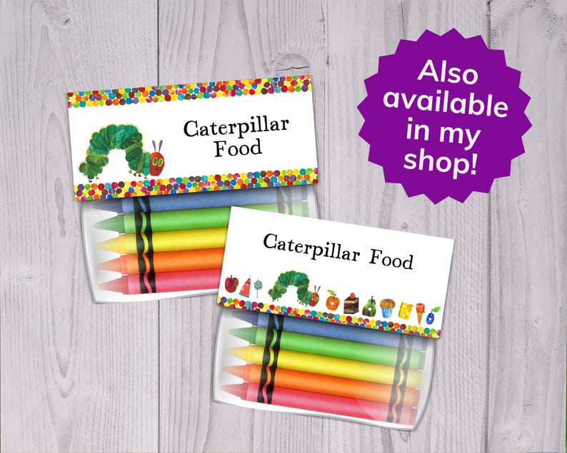 May include: A set of two clear plastic containers with colourful crayons inside. The containers have labels that say "Caterpillar Food". One label features a green caterpillar with a red head and the other label features a green caterpillar with a red head and a variety of colourful foods.