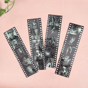 May include: Four black and white film strip bookmarks featuring characters and scenes from the horror movie Silent Hill. The bookmarks are printed on a white background.