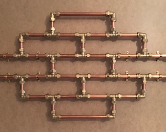Copper Pipe Art Brickwork With Brass Fittings That Can Be Moved Into Various Positions
