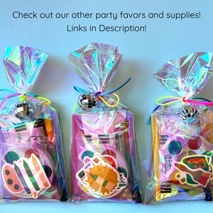 May include: Three iridescent cellophane party favor bags tied with neon strings and small silver disco ball charms. Each bag contains a watercolor paint set, a paintbrush, and a colorful art-themed sticker on the front.