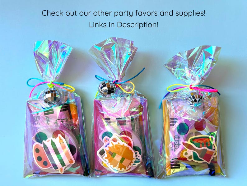 May include: Three iridescent cellophane party favor bags tied with neon strings and small silver disco ball charms. Each bag contains a watercolor paint set, a paintbrush, and a colorful art-themed sticker on the front.
