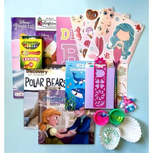 May include: A collection of children's items, including books, crayons, stickers, and a bookmark. The books feature titles like "Disney Princess" and "Polar Bears." The color palette includes pink, blue, and yellow, with a light blue background.