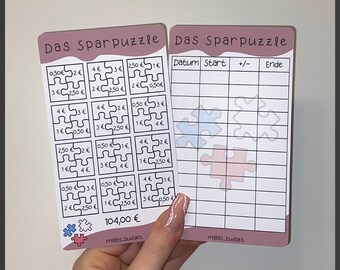 Puede incluir: Un rastreador de ahorros imprimible rosa y blanco con un tema de rompecabezas. El rastreador tiene una cuadrícula con columnas etiquetadas como "Fecha", "Inicio", "+/-" y "Fin". El rastreador también incluye una sección con una cuadrícula de piezas de rompecabezas con diferentes cantidades de dinero escritas en ellas. La cantidad total es de 104,00 euros.