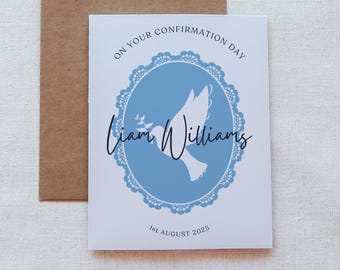 May include: A white card with blue accents and a dove design. The text on the card reads "On your Confirmation Day Liam Williams 1st August 2025".