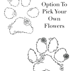 May include: Black and white line drawing of a paw print with floral wreaths. The paw print has the name "Simba" written inside. The text "Option To Pick Your Own Flowers" is written to the right of the paw print.