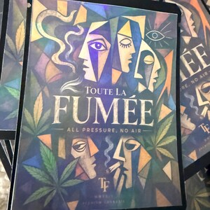 May include: A rectangular product pouch featuring a colorful cubist-style illustration of multiple faces and cannabis leaves. The text reads TOUTE LA FUM&Eacute;E, ALL PRESSURE, NO AIR, and TF MMXIV PREMIUM CANNABIS. The design uses blue, green, and gold tones.