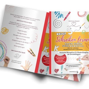 May include: A book titled "Wieder Schreiben lernen" with a colorful cover, featuring illustrations of crayons, scribbles, and hands. The book's title is in German, and it focuses on regaining writing skills after a stroke.