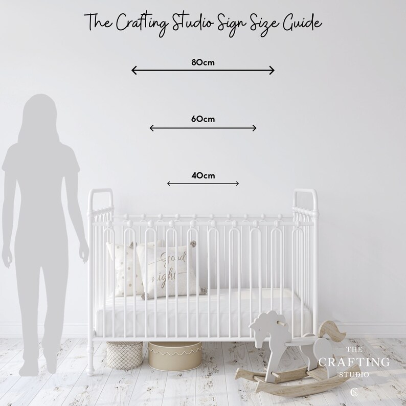 The Crafting Studio Wall Name Sign Size Guide provides a visual guide to the comparable sizes or widths of the name signs when mounted on a wall alongside above a standard cot and silhouette of a woman. The sizes range from 40cm, 60cm and 80cm wide.