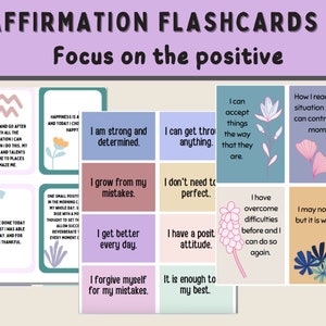 May include: A set of 12 affirmation flashcards with colorful backgrounds and illustrations. The cards feature positive affirmations such as "I am strong and determined" and "I grow from my mistakes".