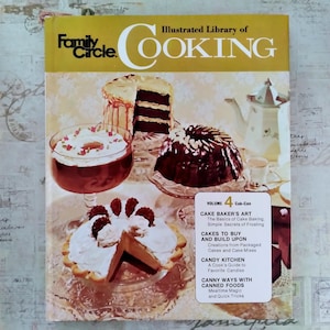 May include: A vintage cookbook titled "Family Circle Illustrated Library of Cooking." The cover features a variety of cakes and desserts, including a layered cake, a bundt cake, and a tart. The book's volume is 4, with sections on cake baking and candy.
