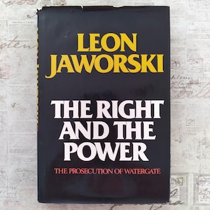 May include: A hardcover book with a black dust jacket featuring the title The Right and the Power, the author Leon Jaworski in large yellow letters, and the subtitle The Prosecution of Watergate in smaller red text at the bottom of the cover.