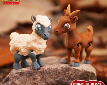 May include: Two 3D printed articulated animal figurines, a brown goat and a white sheep, standing on a rock. The goat has large eyes and a brown body with gray legs. The sheep has a white body with gray legs and a black face. The text "PRINT.IN.PLACE NO SUPPORTS" is visible in the lower right corner of the image.