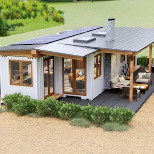 May include: A white, modern, prefabricated home with a gray metal roof and a covered patio. The home has large windows and a wooden deck. Solar panels are on the roof.