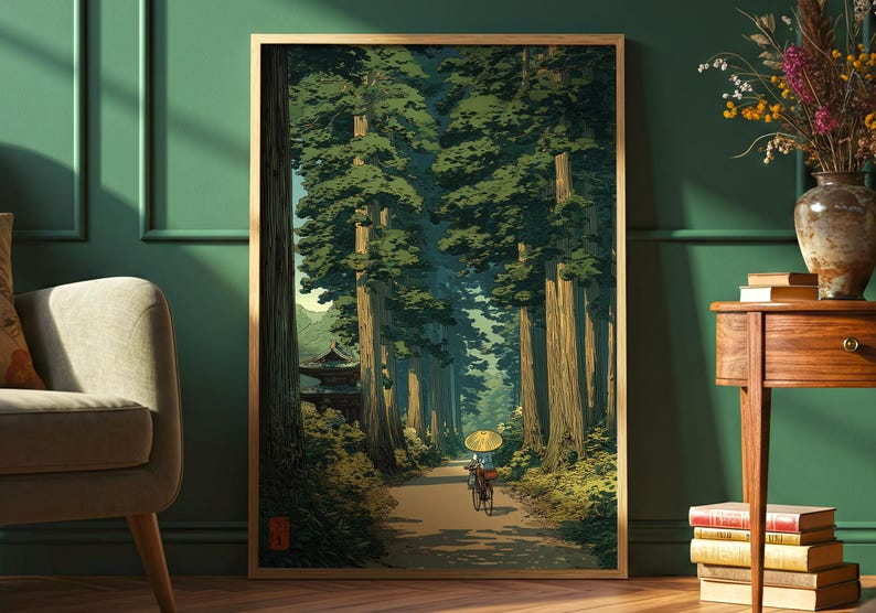 Japanese-inspired art print of an elderly lady cycling through a lush green forest, traditional style poster with calming nature tones, shown framed and displayed in a green room