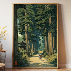 Japanese-inspired art print of an elderly lady cycling through a lush green forest, traditional style poster with calming nature tones, shown framed and displayed in a white room