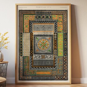 May include: Framed print featuring a detailed, colorful mosaic design with geometric patterns and a central circular motif. The artwork has a vintage aesthetic, with a wooden frame and the text "Pompeian No. 3" at the top. The color palette includes shades of green, orange, and black.