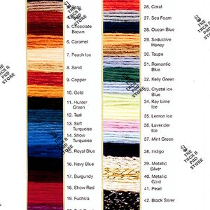 May include: A color chart with 45 different colors of embroidery floss. The colors are arranged in two columns, with the names of the colors listed next to each sample. The colors range from cream to black, with a variety of shades in between.
