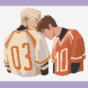 May include: Two people wearing sports jerseys with the numbers 03 and 10 on the back. The person wearing the white jersey with the number 03 is leaning their head on the shoulder of the person wearing the red jersey with the number 10.