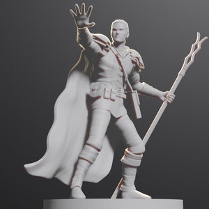 May include: White painted miniature figurine of a person wearing a cloak and holding a staff. The person is standing with one hand raised and the other holding the staff.