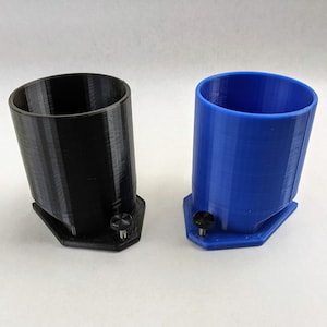 May include: Two 3D printed cups, one black and one blue, with a small knob on the bottom of each.