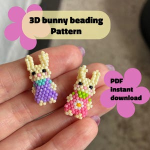 May include: Two miniature beaded bunny figures with cream bodies, black eyes, and colourful outfits. One wears purple and blue, the other pink and green. Text reads "3D bunny beading Pattern" and "PDF instant download".