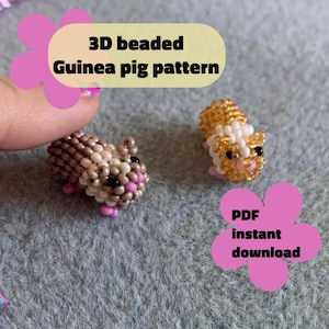 May include: Two beaded guinea pig figurines. One is brown and tan with pink feet, the other is gold and white with black eyes and pink feet. The image includes text that says "3D beaded Guinea pig pattern" and "PDF instant download".