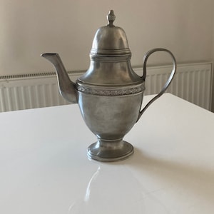 Antique vase shaped pewter tea or coffee pot from 19th century